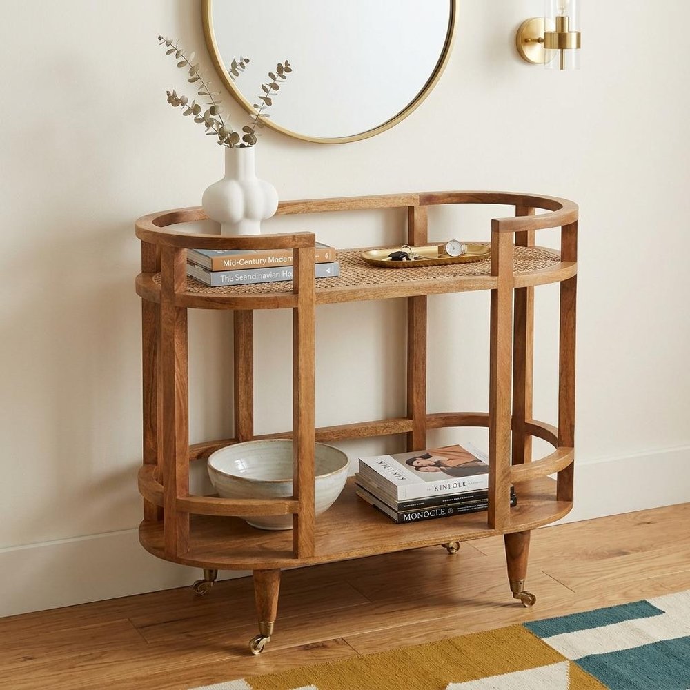 35" Golden Brown Rattan and Solid Wood Oval Wheel Console Table With Shelf