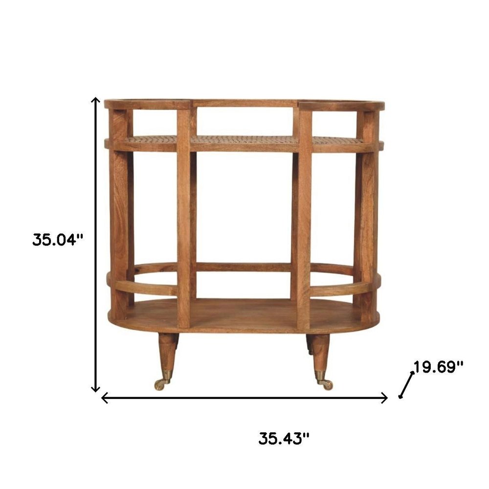 35" Golden Brown Rattan and Solid Wood Oval Wheel Console Table With Shelf