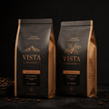 Two premium coffee bean bags with bronze foil typography