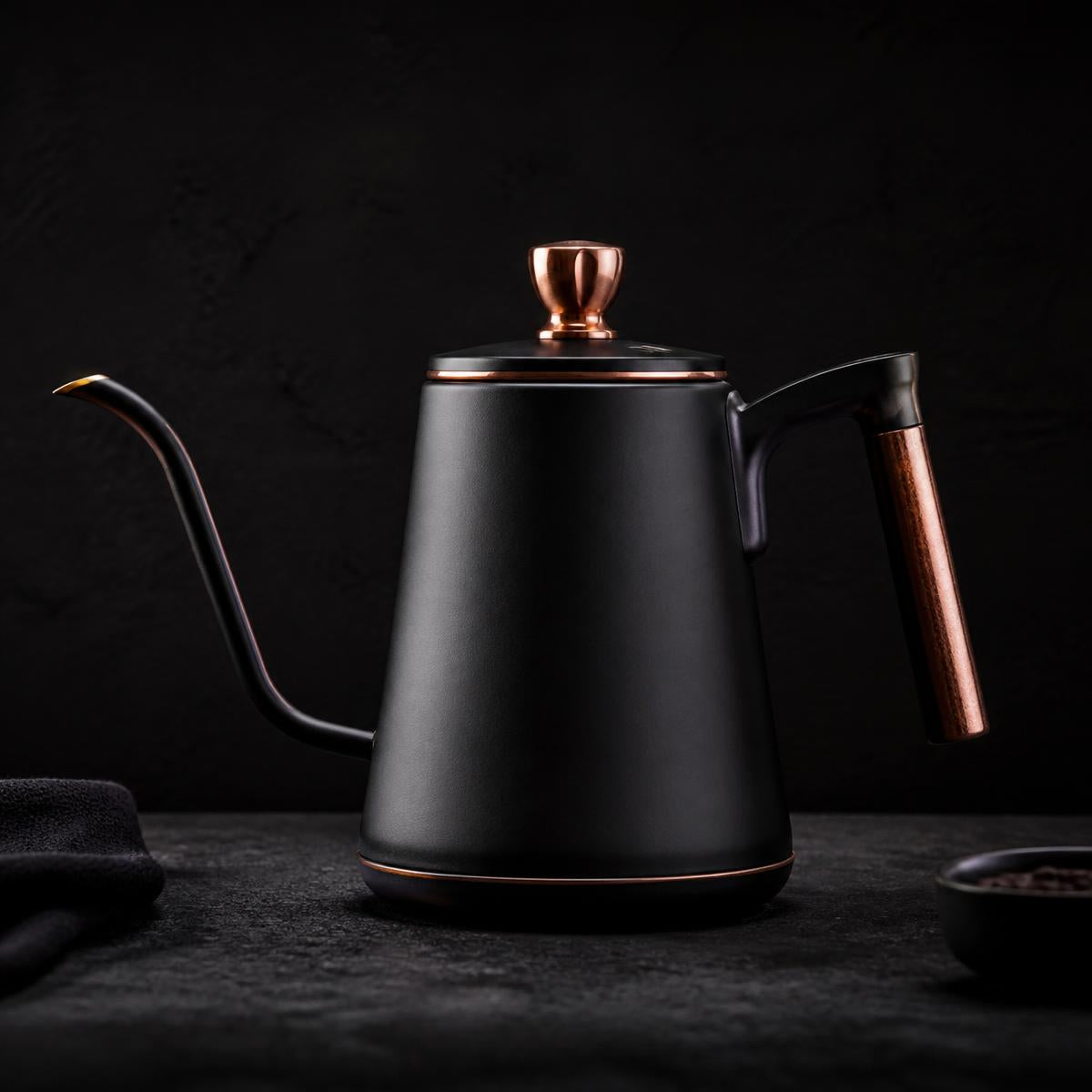 Matte black gooseneck kettle with copper handle